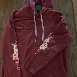 Women’s hoodie size medium with flowers on arms